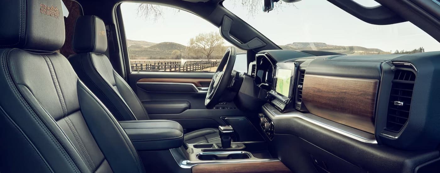 The black interior and dash in a 2024 Chevy Silverado High Country is shown.