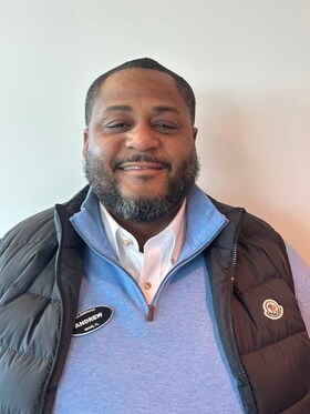 Staff member Andrew Auguste from ID_d3e9651f7ab9