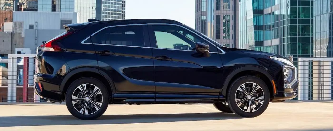 A black 2022 Mitsubishi Eclipse Cross parked in an empty lot at a Mitsubishi dealer near me.
