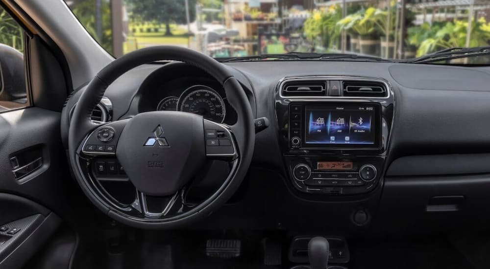 The black dash in a 2024 Mitsubishi Mirage is shown.