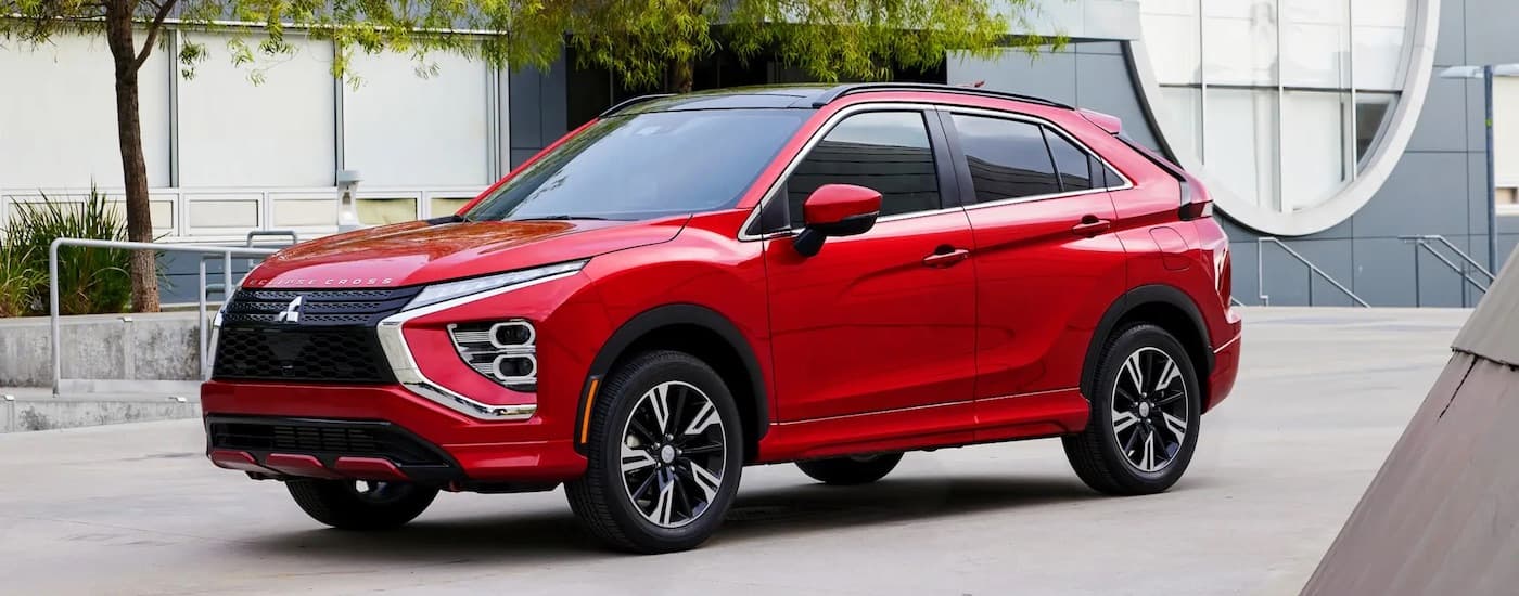 A red 2024 Mitsubishi Eclipse Cross for sale near Waldorf is shown from the front at an angle.