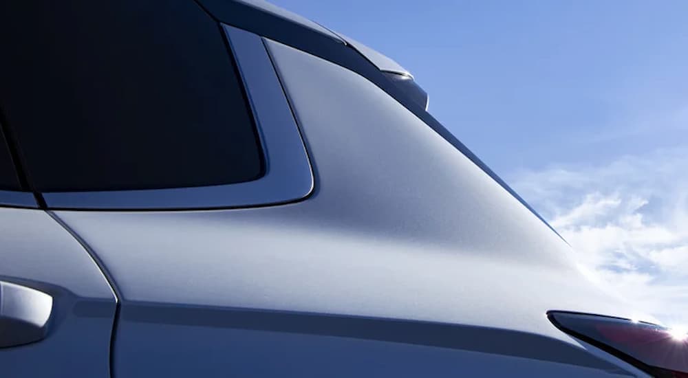 A close up of the rear side of a silver 2024 Mitsubishi Outlander.