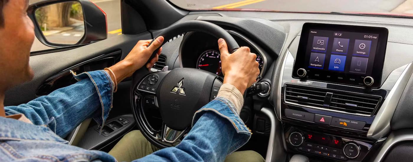 Interior view of the driver and infotainment screen in a 2023 Mitsubishi Eclipse Cross.