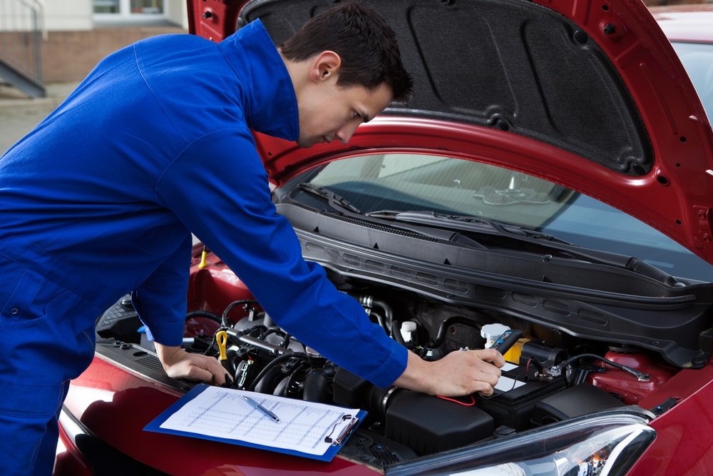 working under the hood of a car