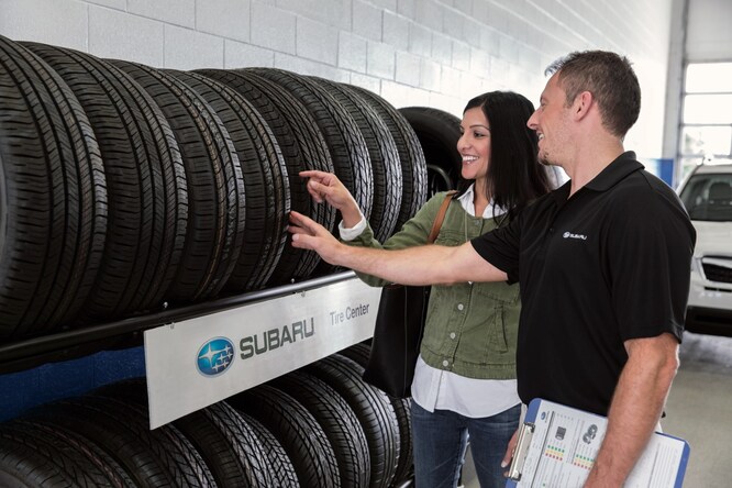 S7781017_SUB_ServiceRepWithCustomerTireRack_slp.jpg