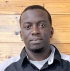 Staff member Malik Caine from f0a3e8670459