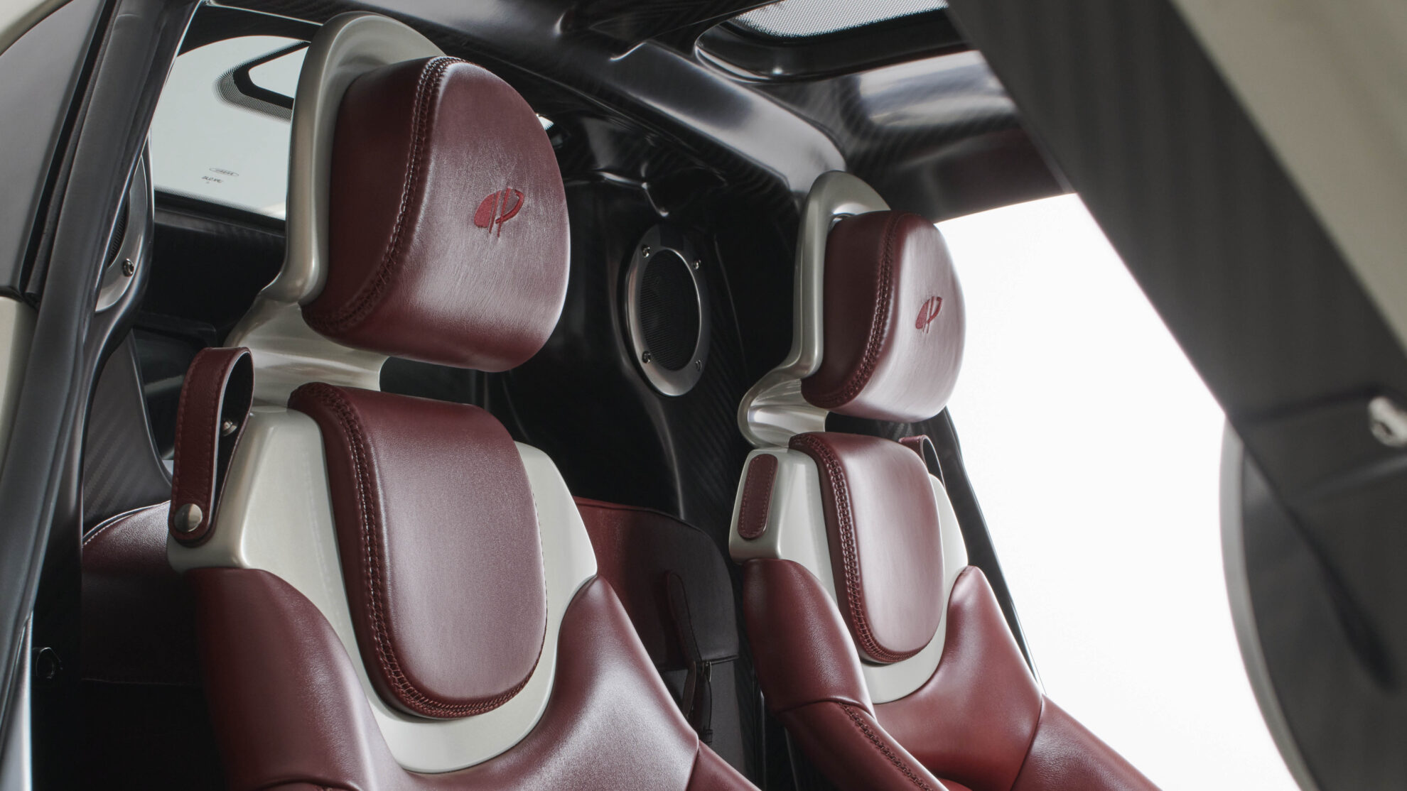  Person cheerfully signing documents.