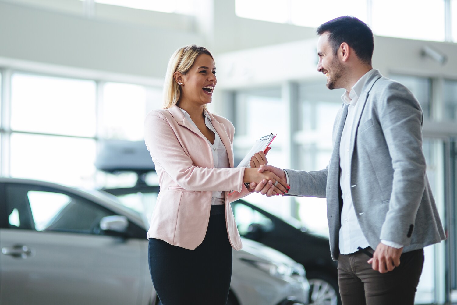 sales associate shaking hands with customer