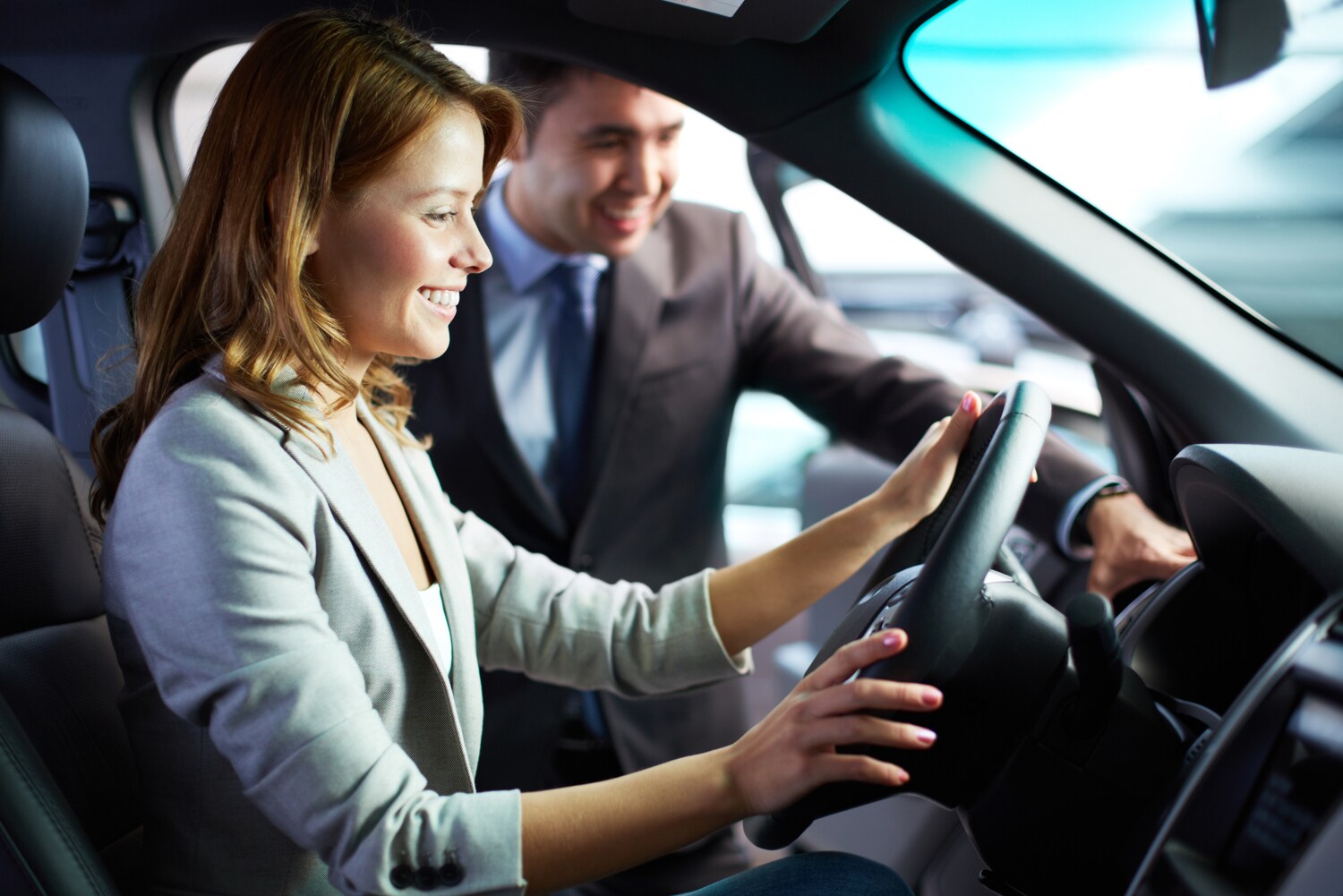 sales associate helping customer choose vehicle