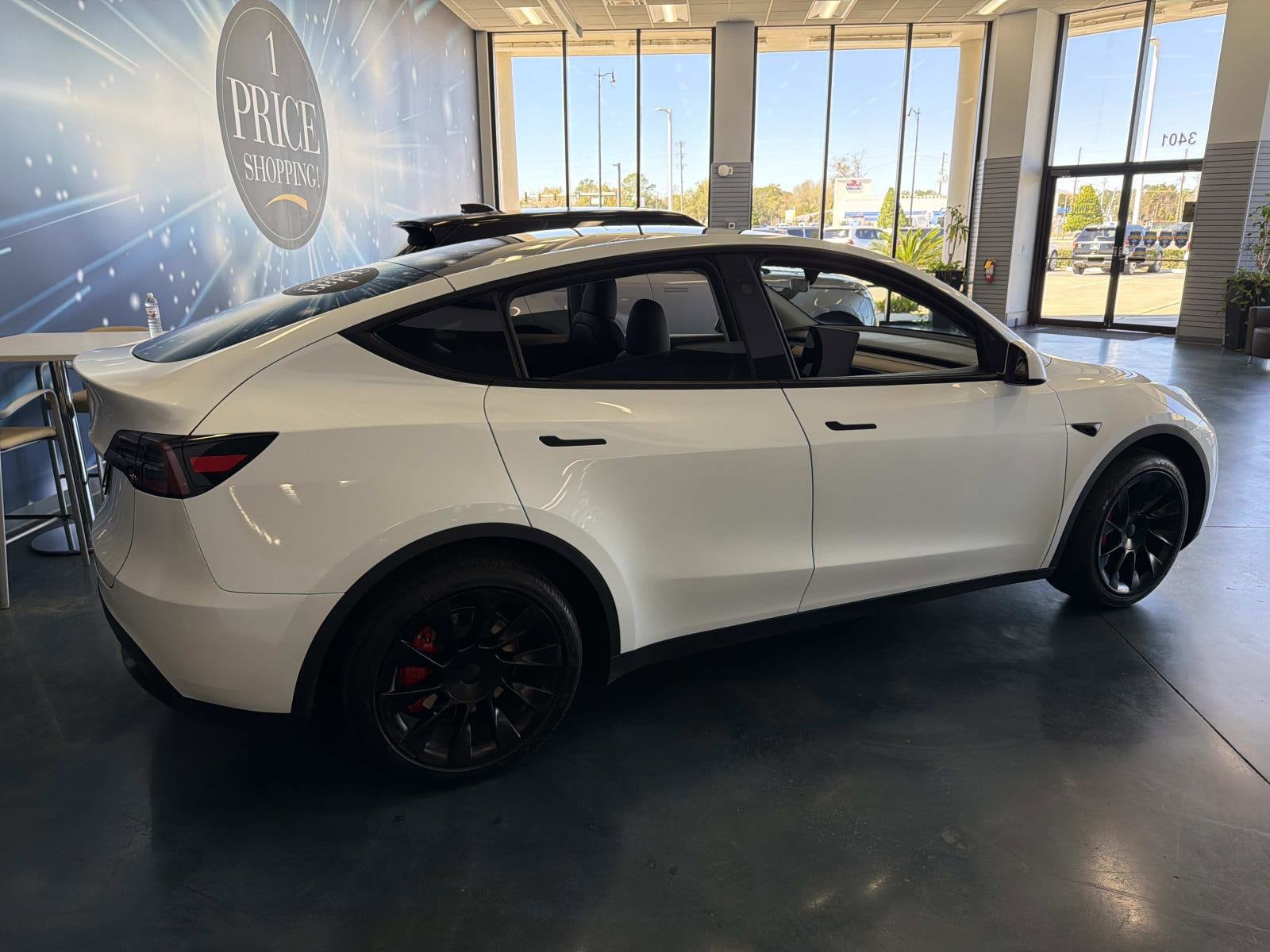 Used 2025 Tesla Model Y Long Range with VIN 7SAYGDED4SF261446 for sale in Longwood, FL
