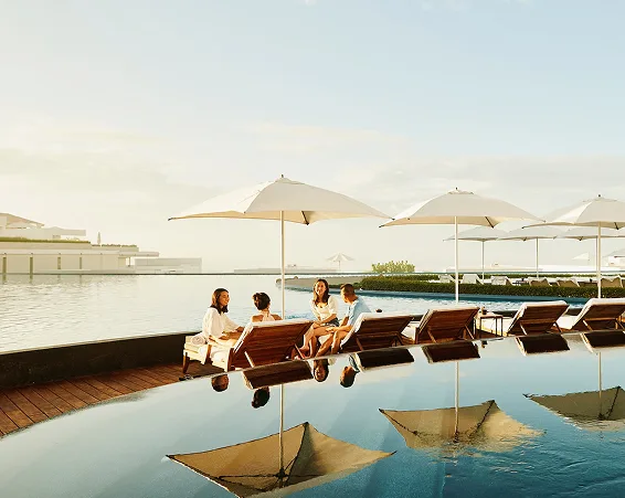 Guests relaxing at a resort pool
