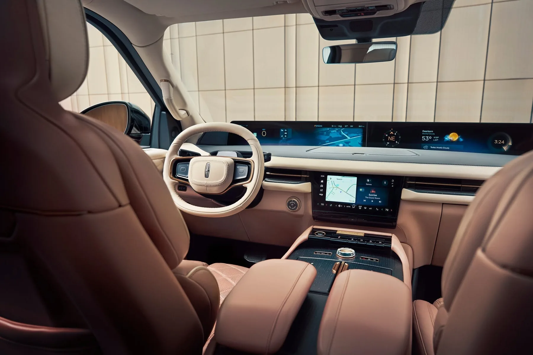 Interior of the Navigator Black Label showing the full-width panoramic display, Lincoln steering wheel, and two-tone leather