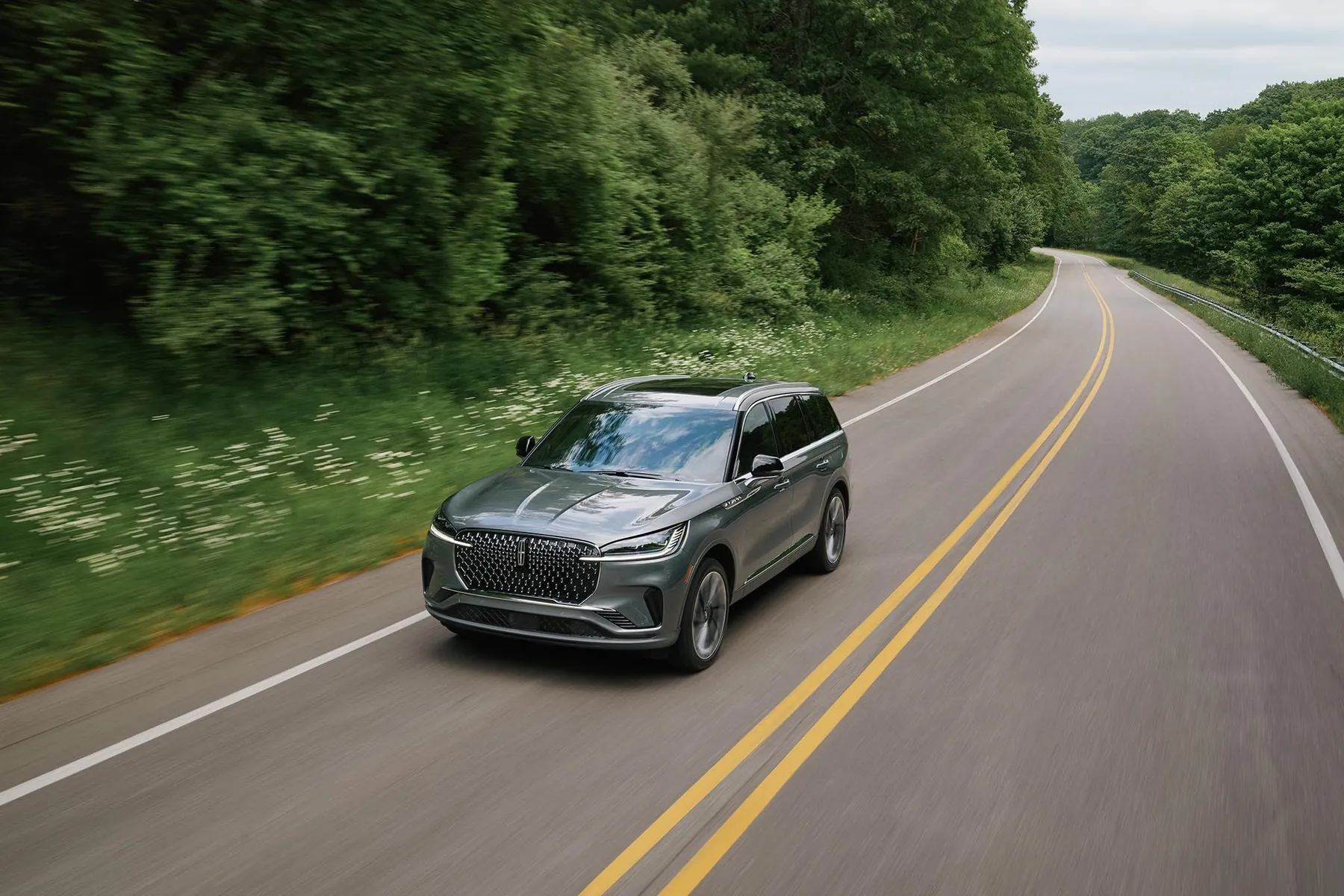 A Lincoln Aviator driving along a two-lane highway
