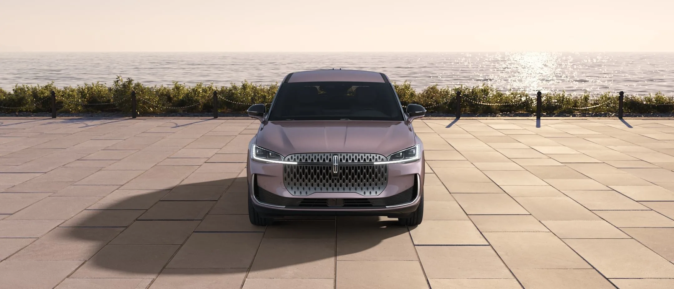A Lincoln SUV in Tinted Copper parked on a terrace above the ocean