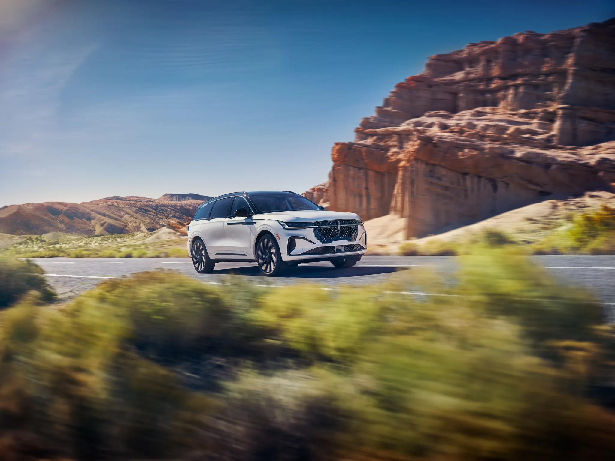 Lincoln Nautilus Black Label driving on scenic coastal highway