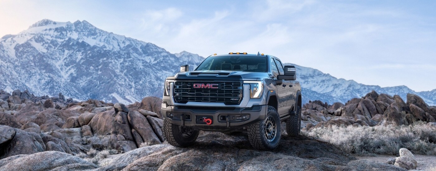 A grey 2025 GMC Sierra 2500 AT4X from the front after leaving one of the GMC dealers near Mt Pleasant.