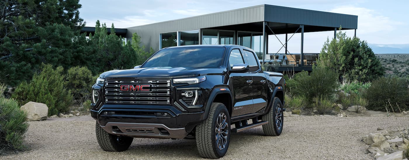 A black 2025 GMC Canyon from the front at an angle after leaving one of a the GMc dealers near Lewisburg.