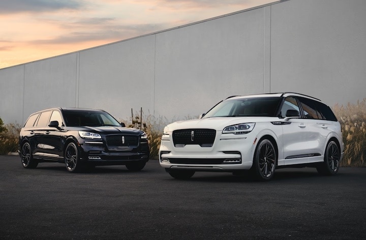 Two Certified Pre-Owned Lincoln vehicles parked outside.