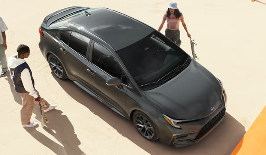  Person cheerfully signing documents.