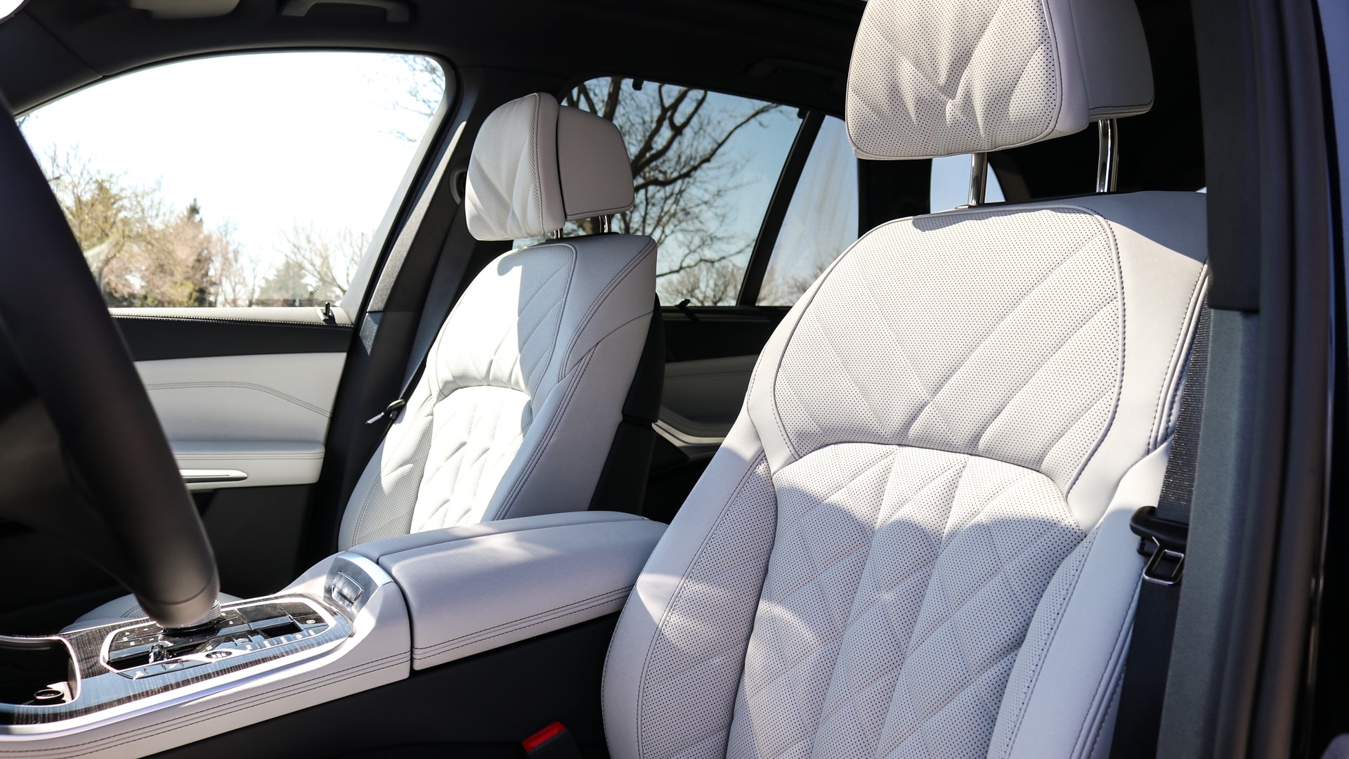 Interior of the 2026 BMW X5 featuring premium leather seats, modern dashboard with large touchscreen display, ambient lighting, and luxurious cabin design, showcased at Patrick BMW in Schaumburg, IL.
