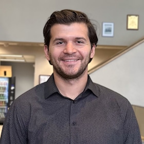 Staff member Nickolai Draganov from ID_6a634e695e6a