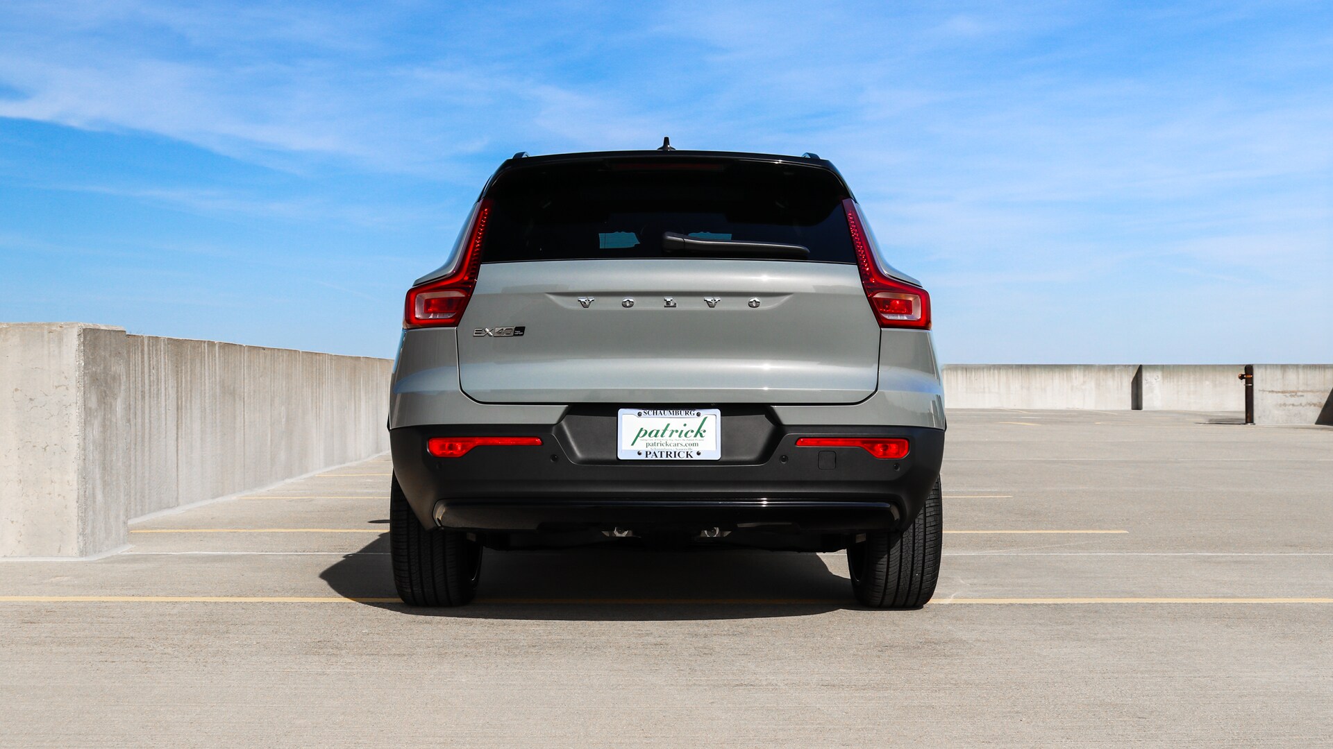 Rear view of the 2025 Volvo EX40 showcasing its sleek taillight design, aerodynamic lines, and modern electric SUV styling.