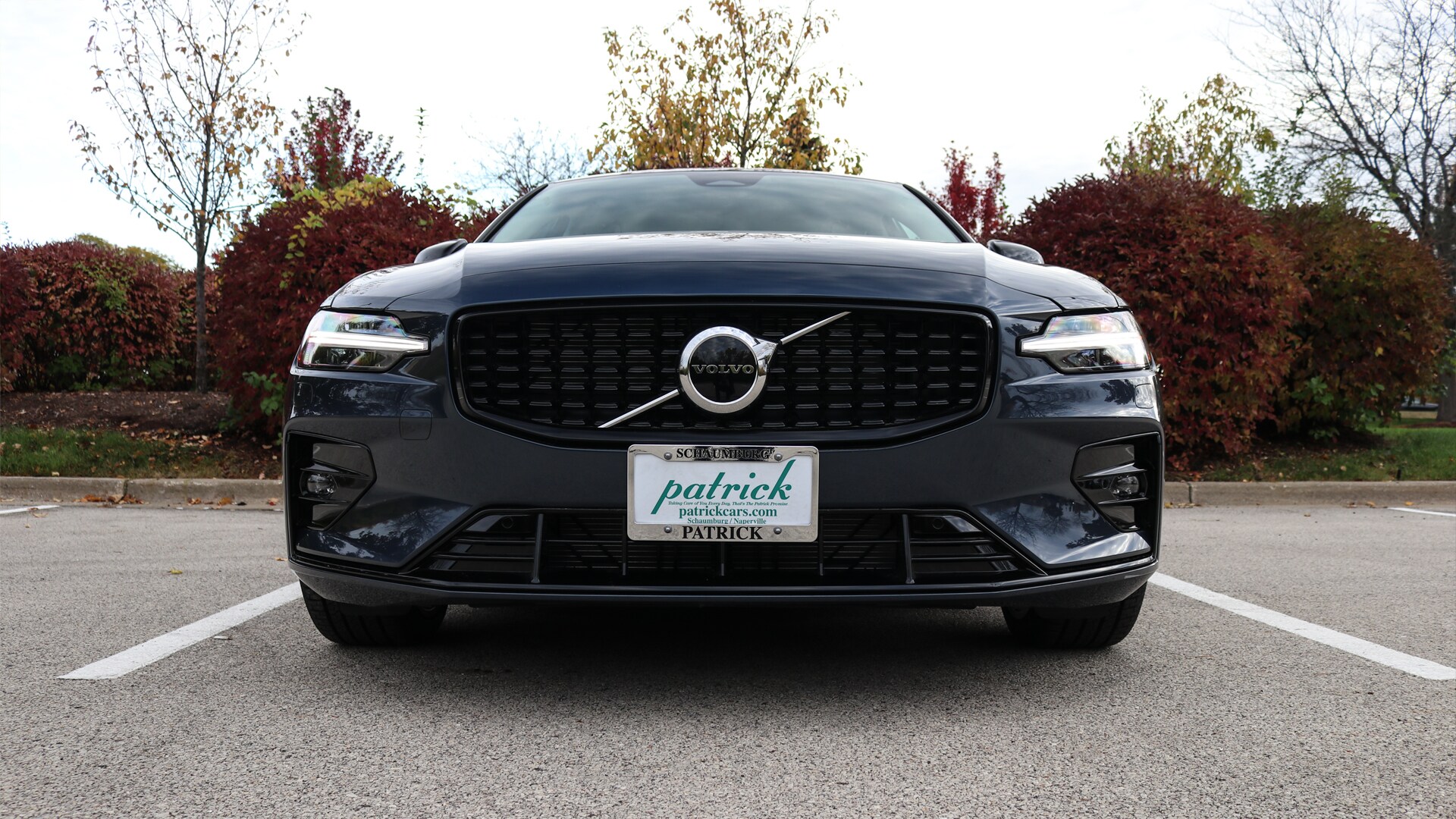 Front view of the 2025 Volvo S60 showcasing its sleek grille, signature Thor's Hammer LED headlights, and modern Scandinavian design.