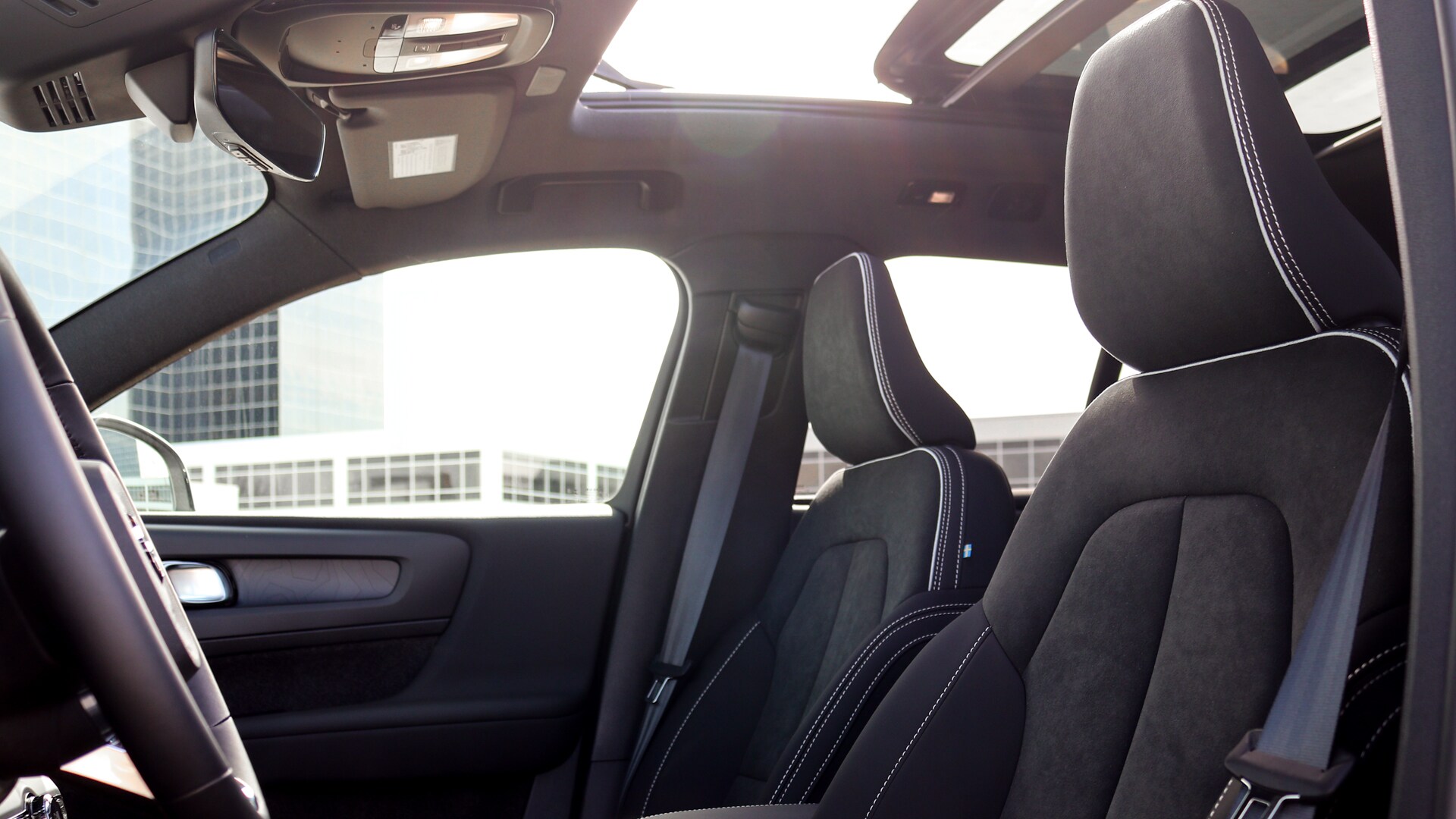 Front seats of the 2025 Volvo EX40 showcasing modern design, premium materials, and spacious comfort.