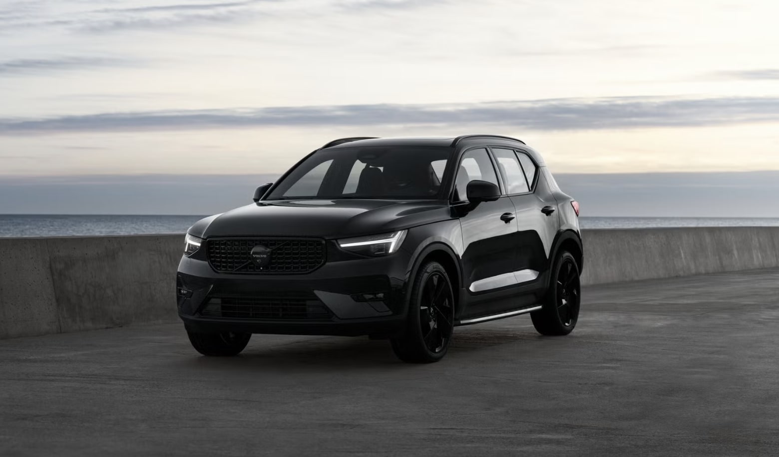 Close-up of the 2026 Volvo XC40 Black Edition highlighting blacked-out badging, wheels, and trim accents.