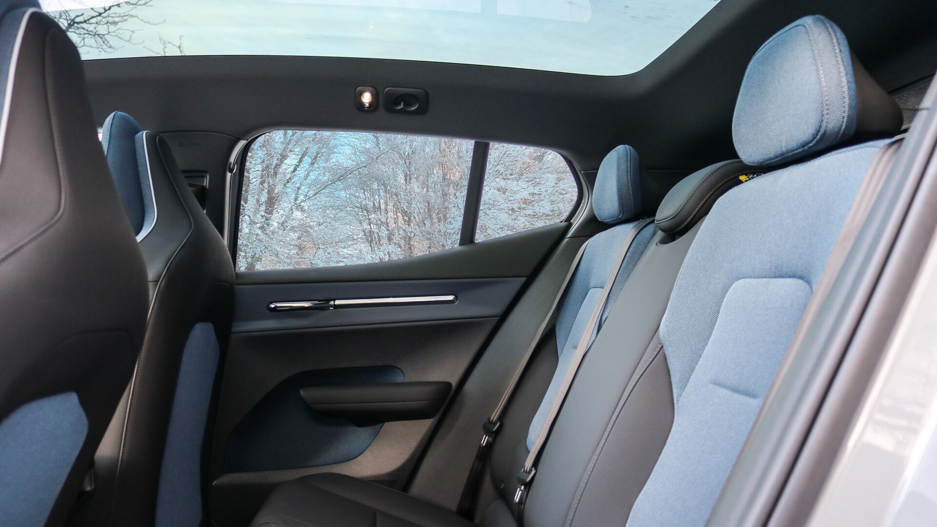 2025 Volvo EX30 backseat interior showcasing spacious, modern seating with minimalistic design and ample legroom for passengers.