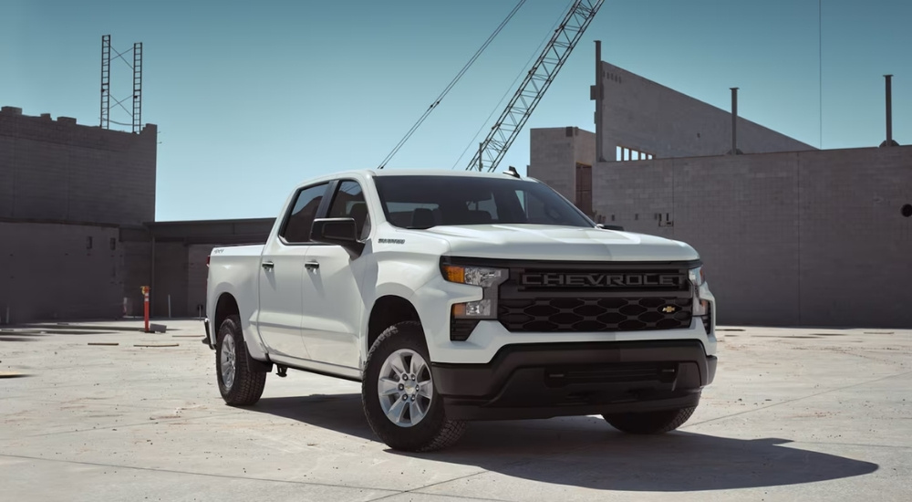 2026%20Chevy%20Silverado%201500%20-%20Pylon%202.jpg White 2026 Chevy Silverado 1500 parked near buildings