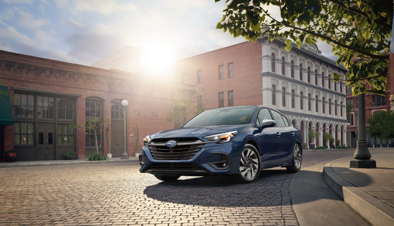 Subaru Legacy on cobblestone street