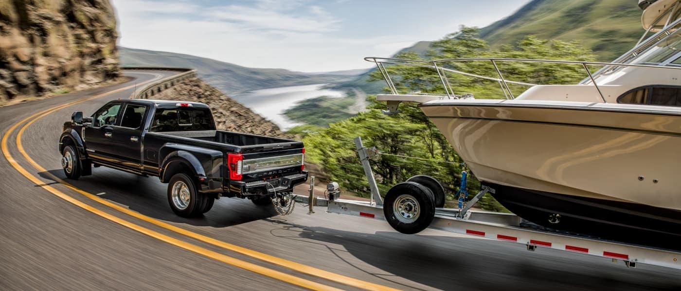 Ford Superduty truck towing a boat