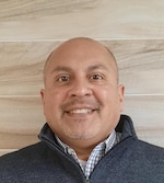 Staff member Chris Moreno from ID_a89b593ec816