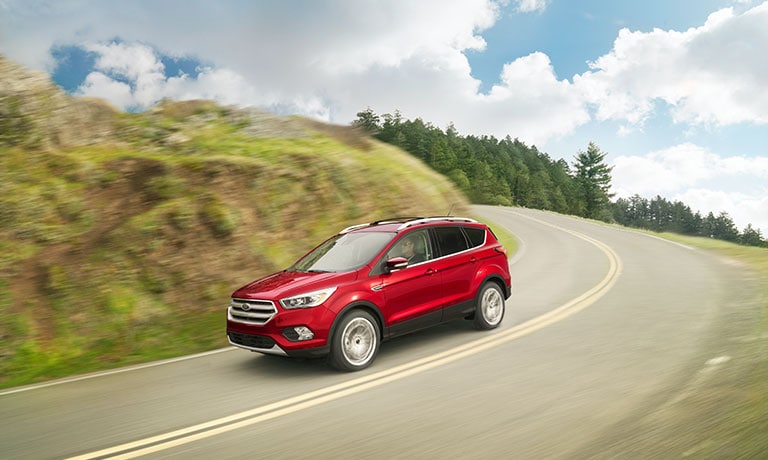 2019 Ford Escape driving down hill
