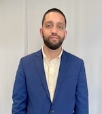 Staff member Alex Reynoso from ID_8f7f9cf4a94a