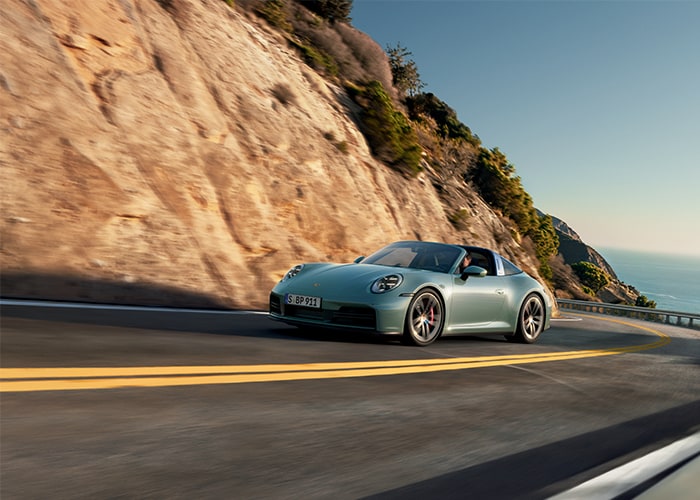2025 Porsche 911 driving on highway