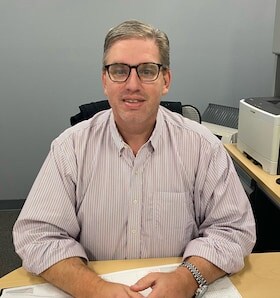Staff member CYRUS BARGER from ID_4ca2e0