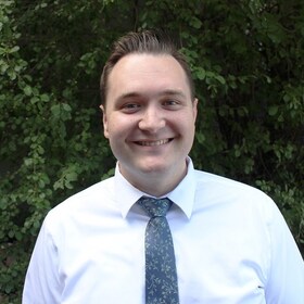 Staff member Chris Compton  from ID_6cee74a6442e