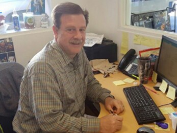 Staff member John Kemp from e31bc3dc79a7