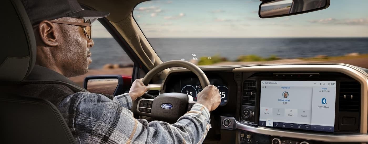 The interior of a 2025 Ford F-150 from the rear seats.