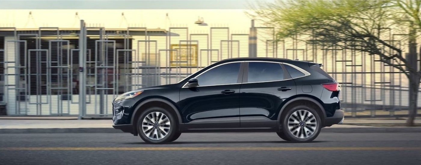A black 2022 Ford Escape from the side after leaving a dealer that has a used Ford for sale in Peoria.