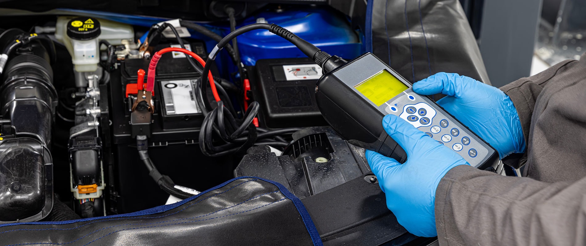 Ford technician performing a battery check