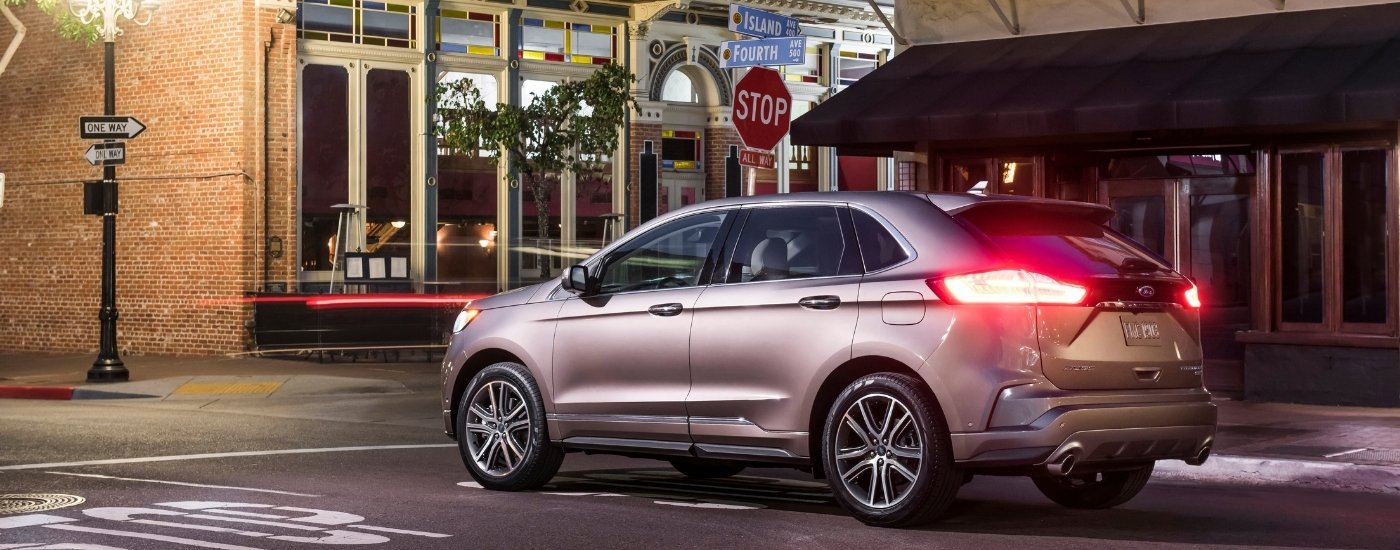 A silver 2022 Ford Edge from the side.
