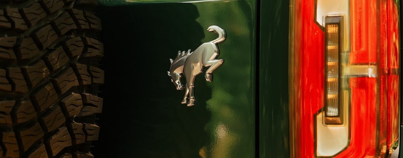 Rear tail light and badge on a green 2026 Ford Bronco