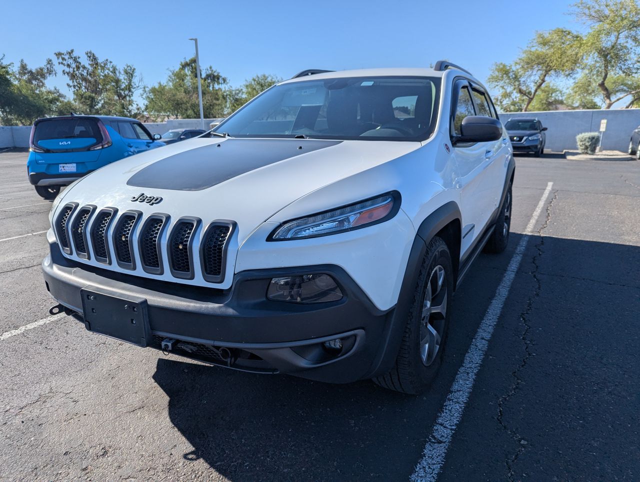 Used 2015 Jeep Cherokee Trailhawk with VIN 1C4PJMBS4FW609874 for sale in Peoria, AZ