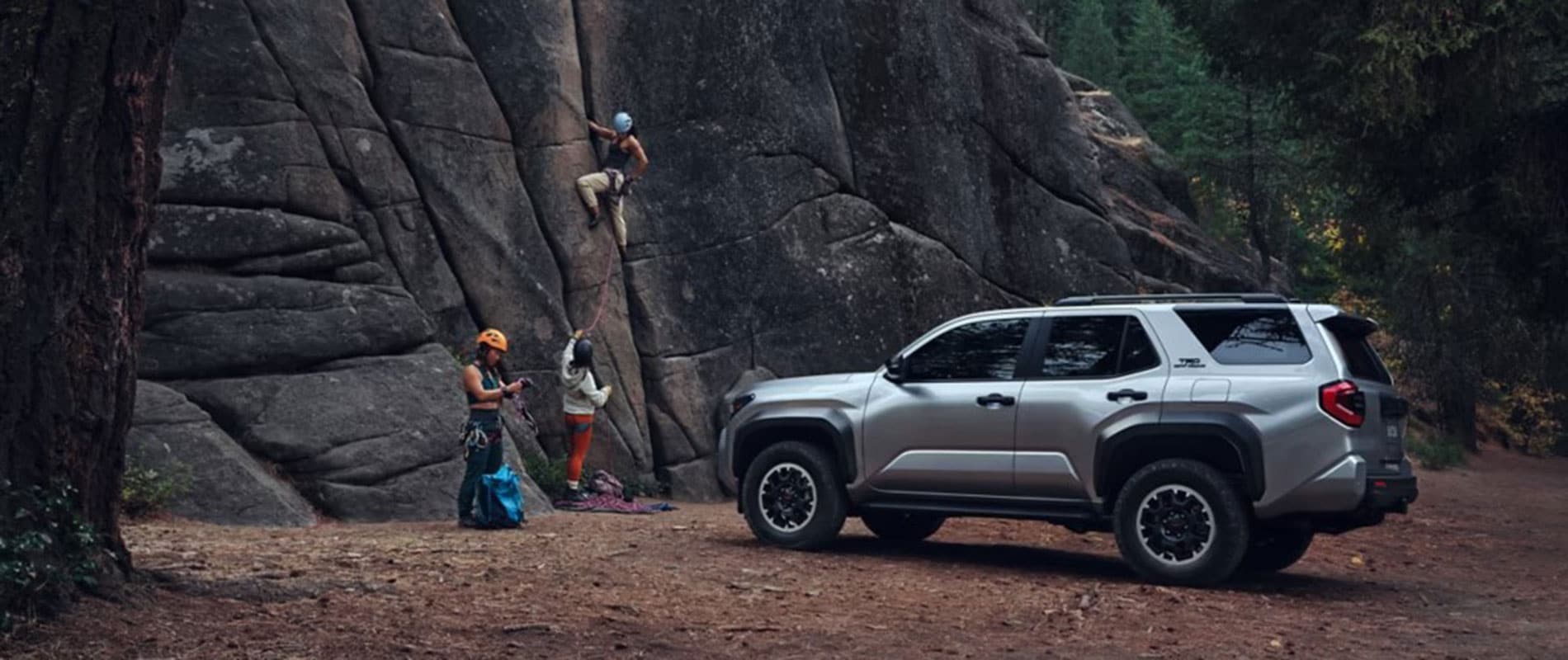 2025 Toyota 4Runner parked by a rock wall