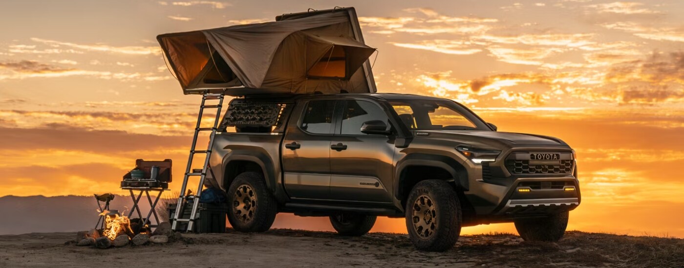 Brown 2026 Toyota Tacoma Trailhunter parked off-road