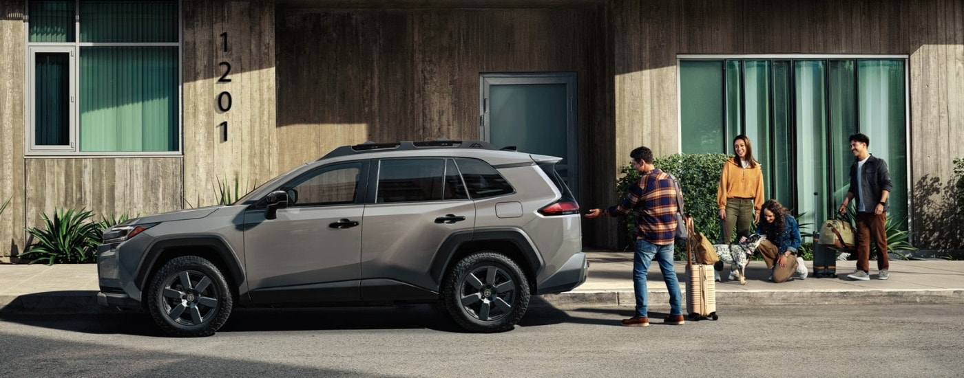 A brown 2026 Toyota RAV4 from the side.