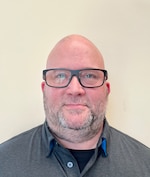 Staff member Aaron McLean from ID_d76cd456c479